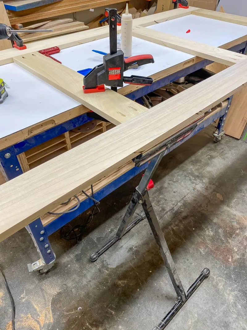 Assembling screen door on workbench