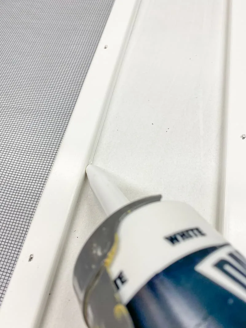 Caulk the seam between the moulding and the frame