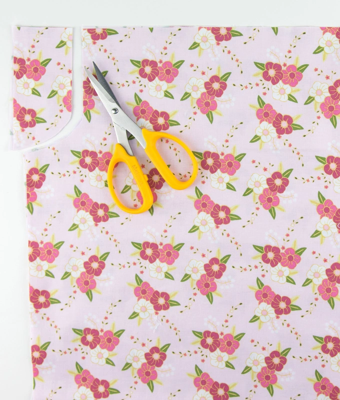 Cutting armholes on floral material