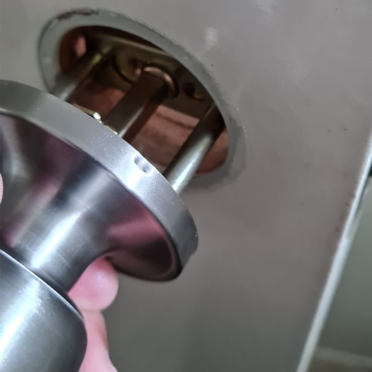 Insert door knob into latch body