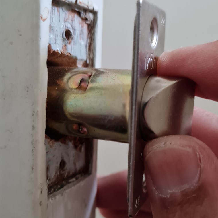 Insert new latch into door