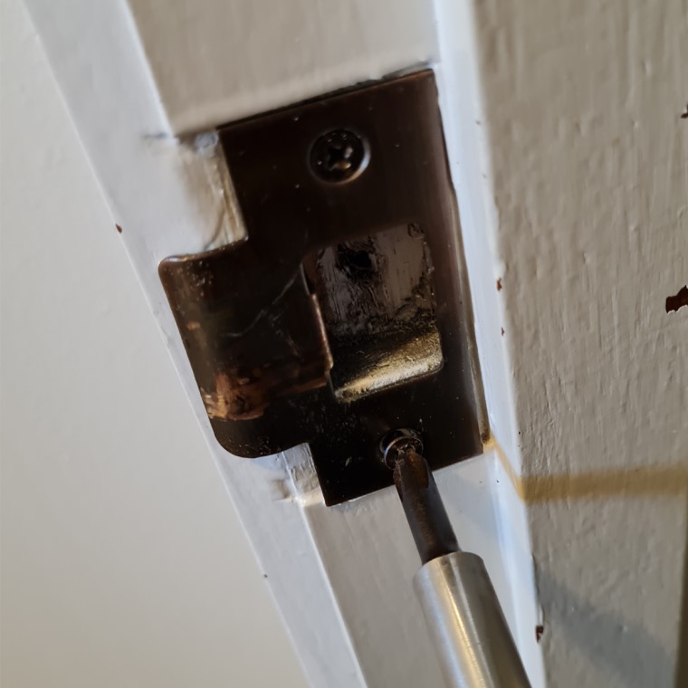 Remove old striker plate