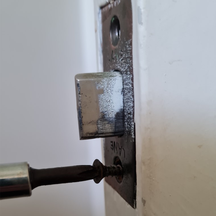 Remove screws from latch