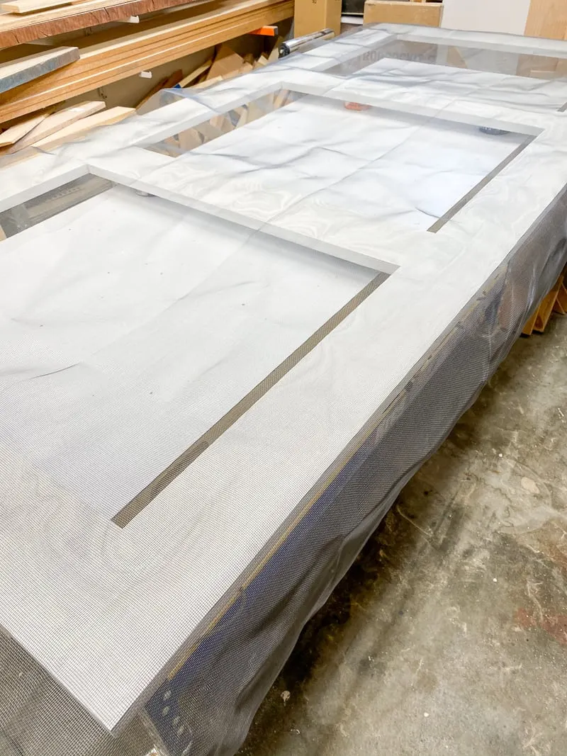 Screen material covers the entire door