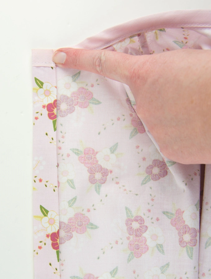 Stitch through the center of the back of the dress