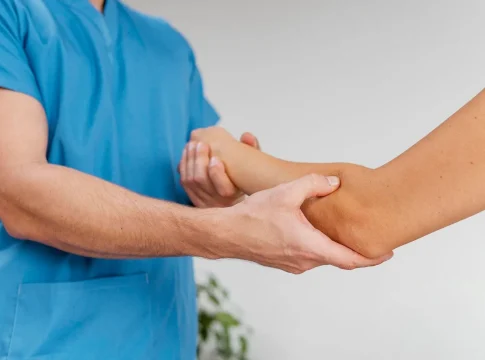 The doctor checks the nerves in the arm