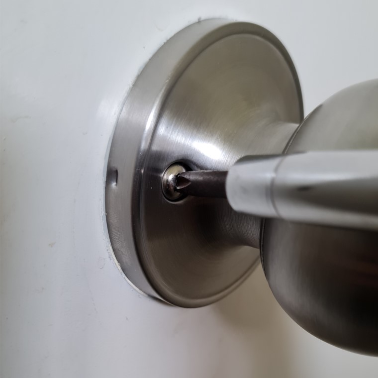 Tighten screw to secure cover flange